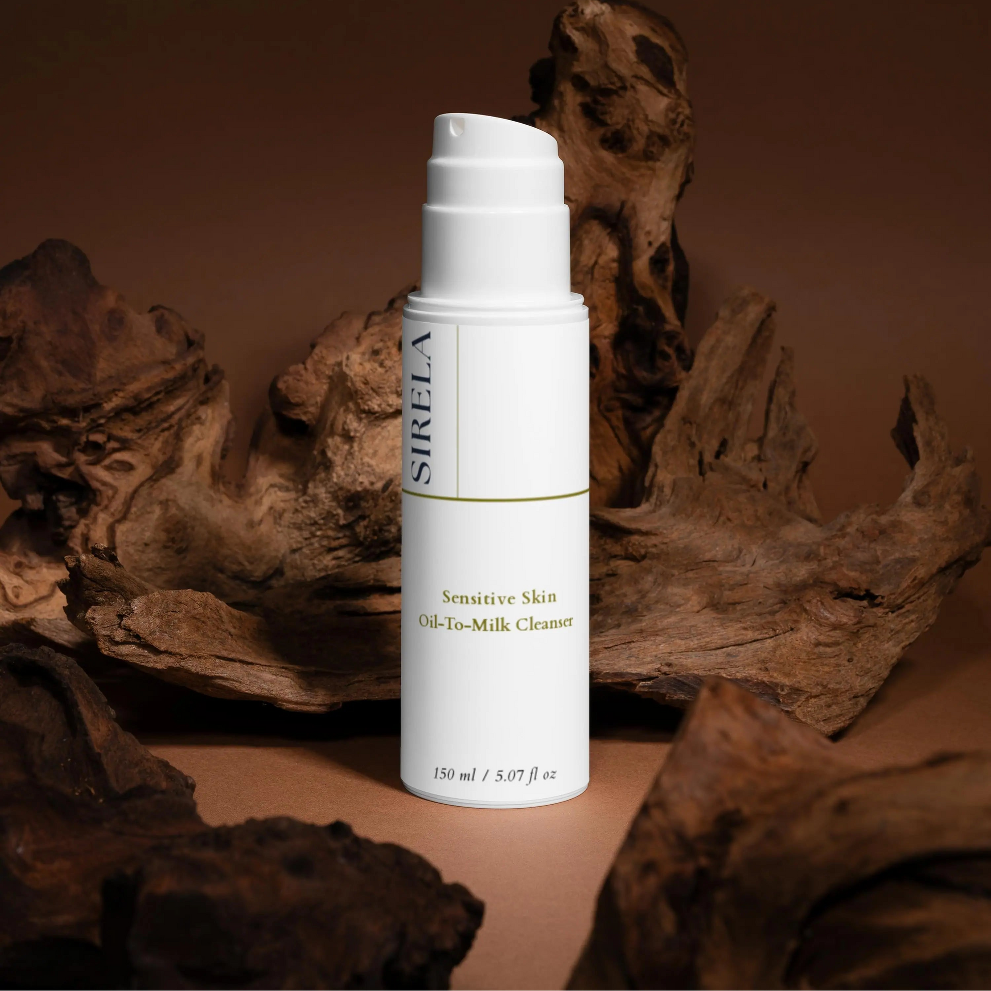 Sirela sensitive oil-to-milk cleanser on a dark wood background