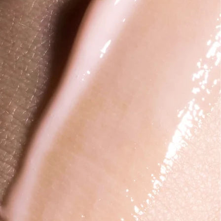 Close-up of a smooth, beige-colored skin texture